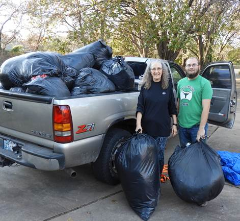 Denton Walker and Anaswara with a truckfull of plastic bags
