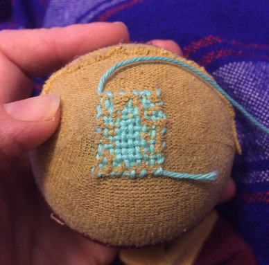 A completed darning grid