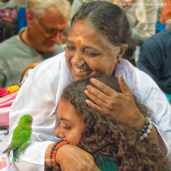 Amma giving darsahn to girl and parrot