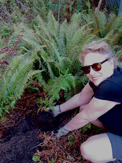 Vijaya Taylor planting a Western Red Cedar 