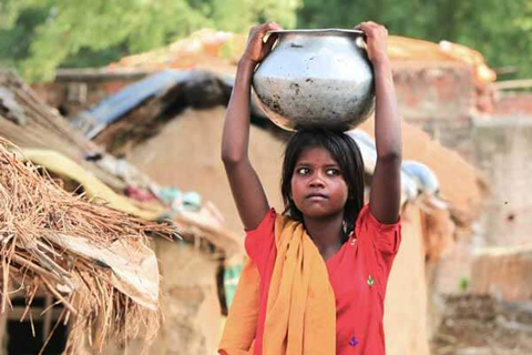 Girl carries water